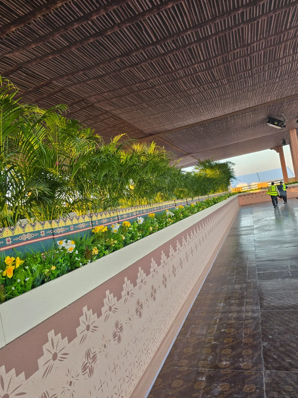 Real completed project: large-scale planter styling along a venue walkway