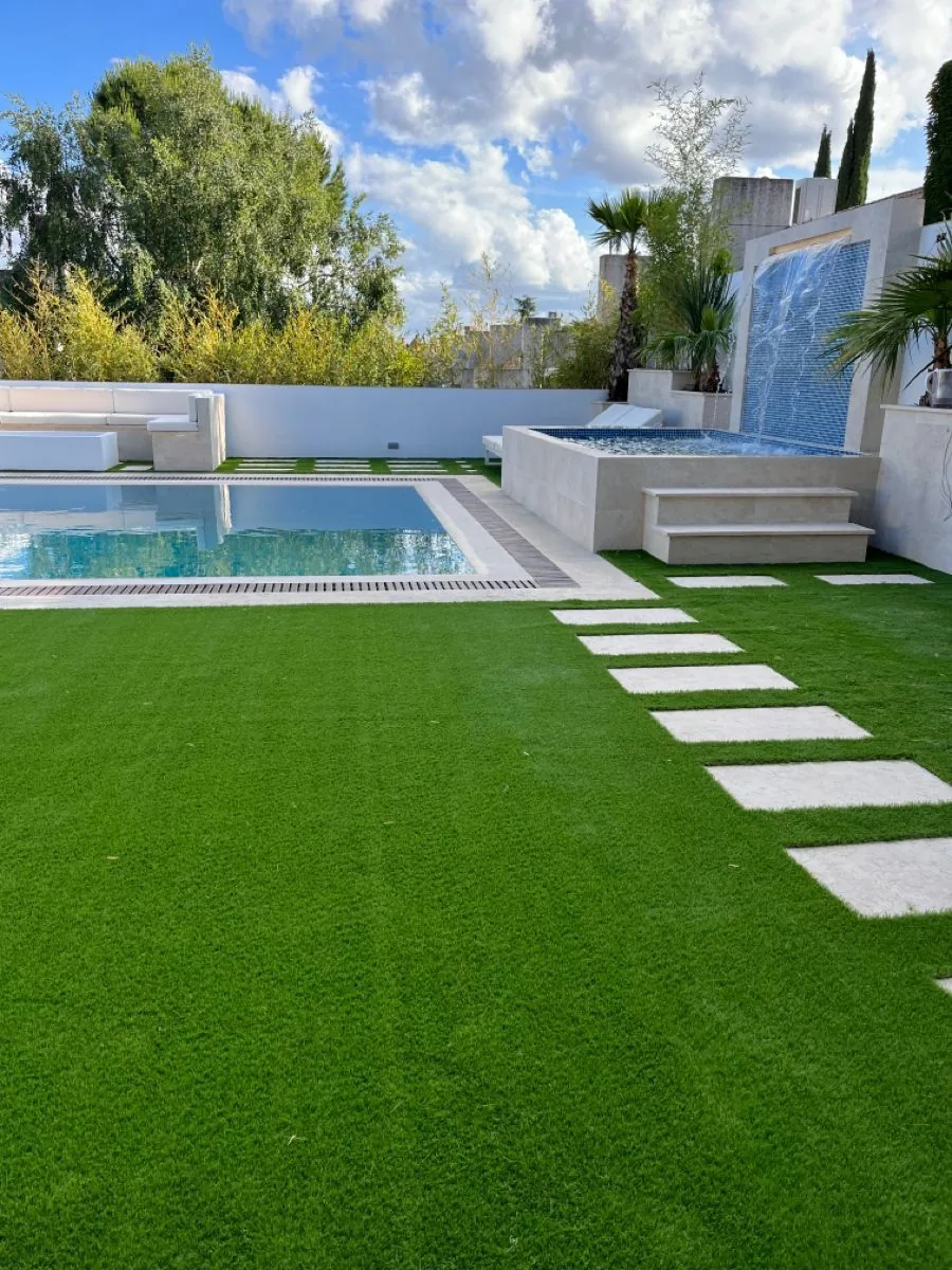 Villa garden and pool area with lush greenery